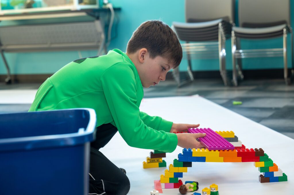 picture of a child playing with legos